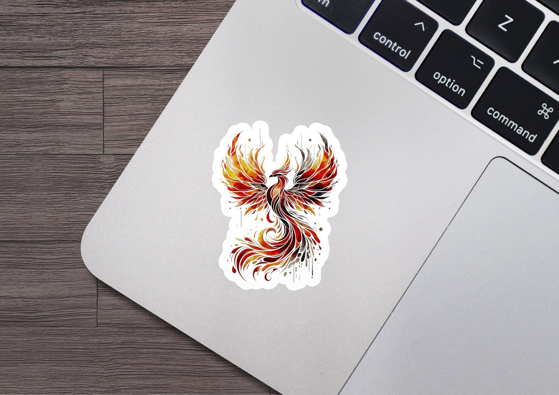 a laptop with a sticker of a bird on it