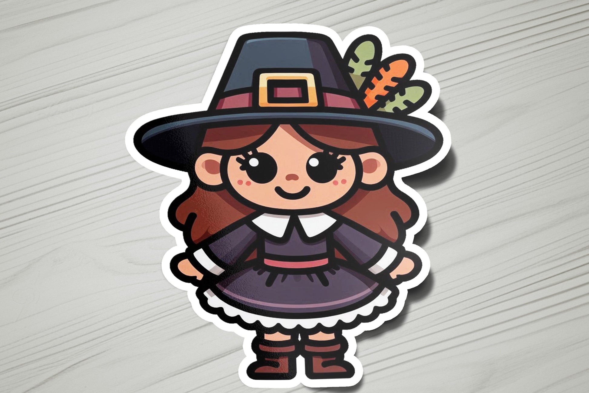 a sticker of a girl in a witch costume