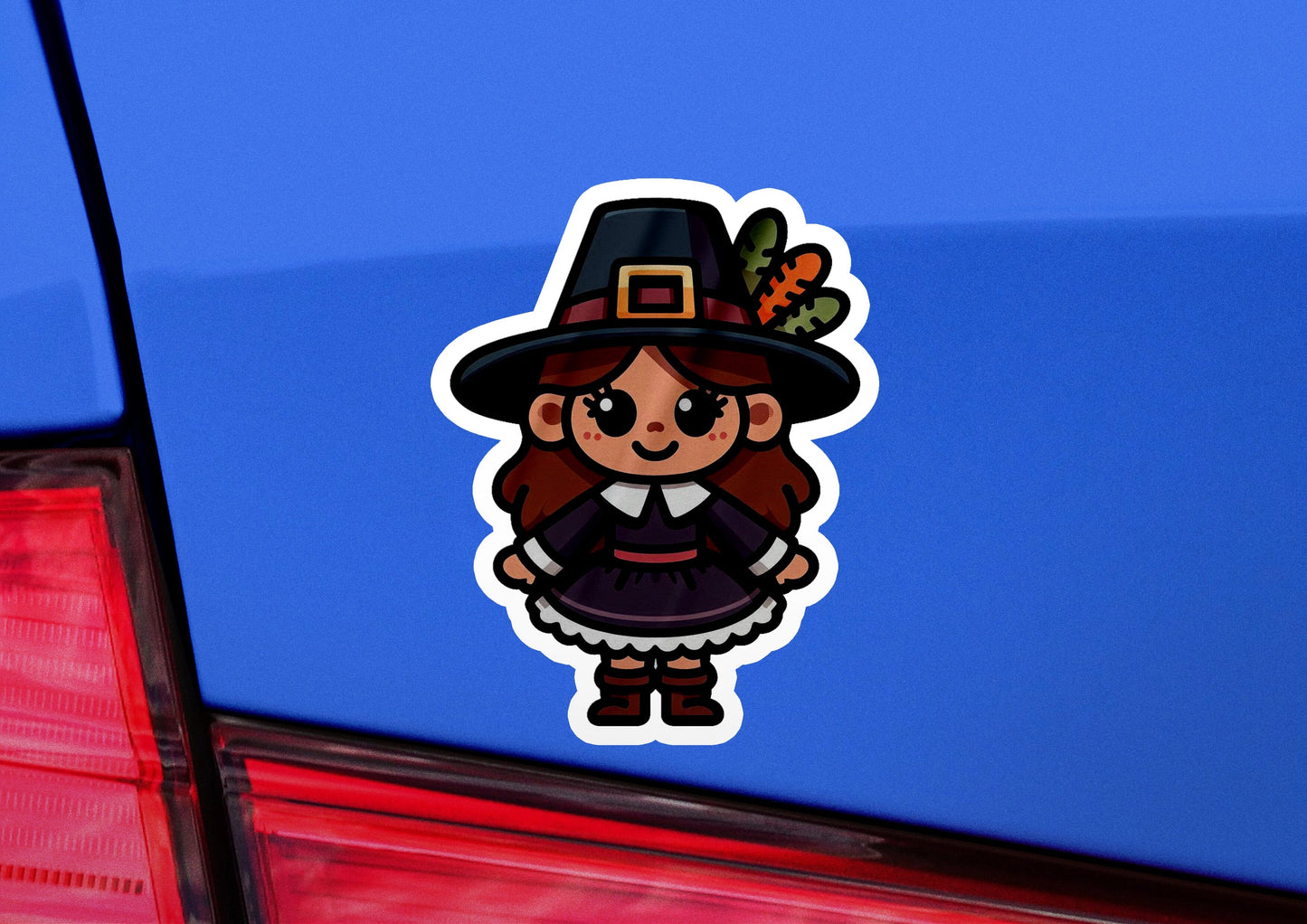 a car with a sticker of a girl in a witches hat