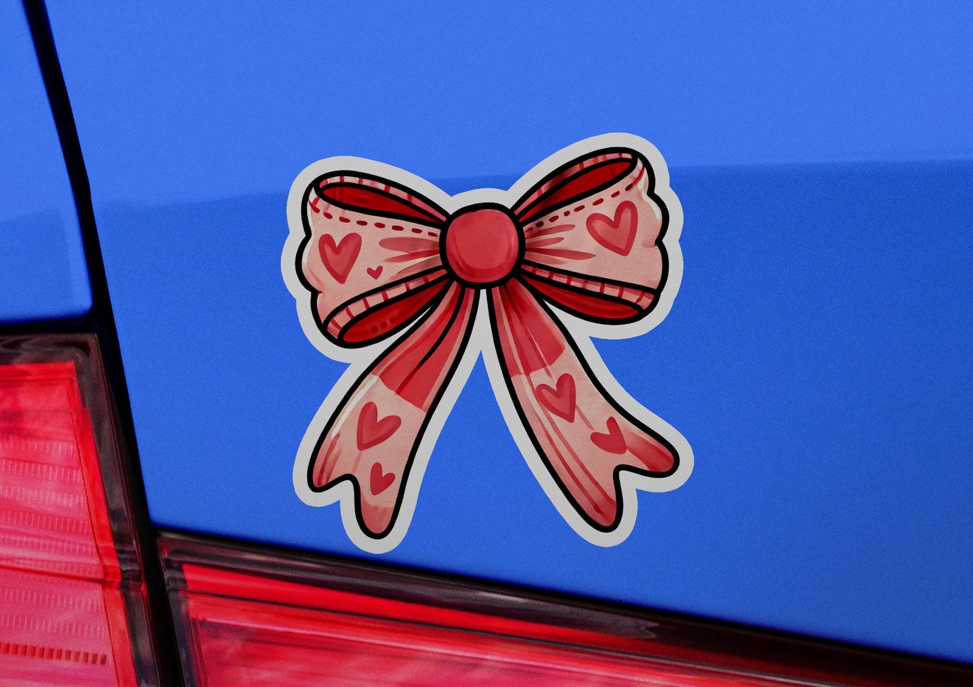 a car with a bow on the back of it
