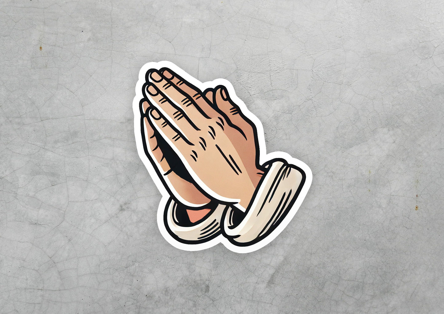a sticker of a praying hand on a gray background