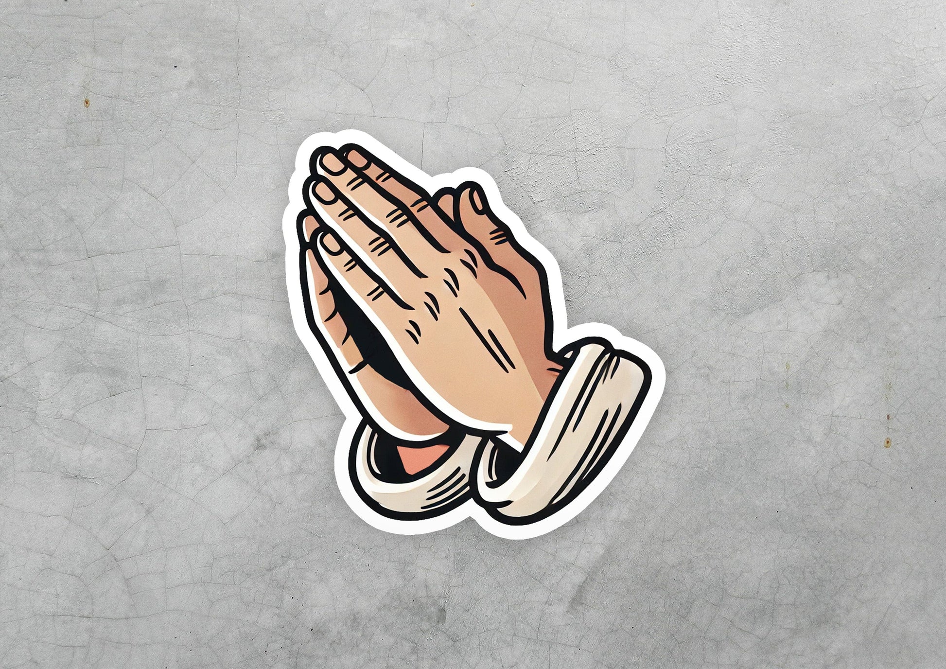 a sticker of a praying hand on a gray background