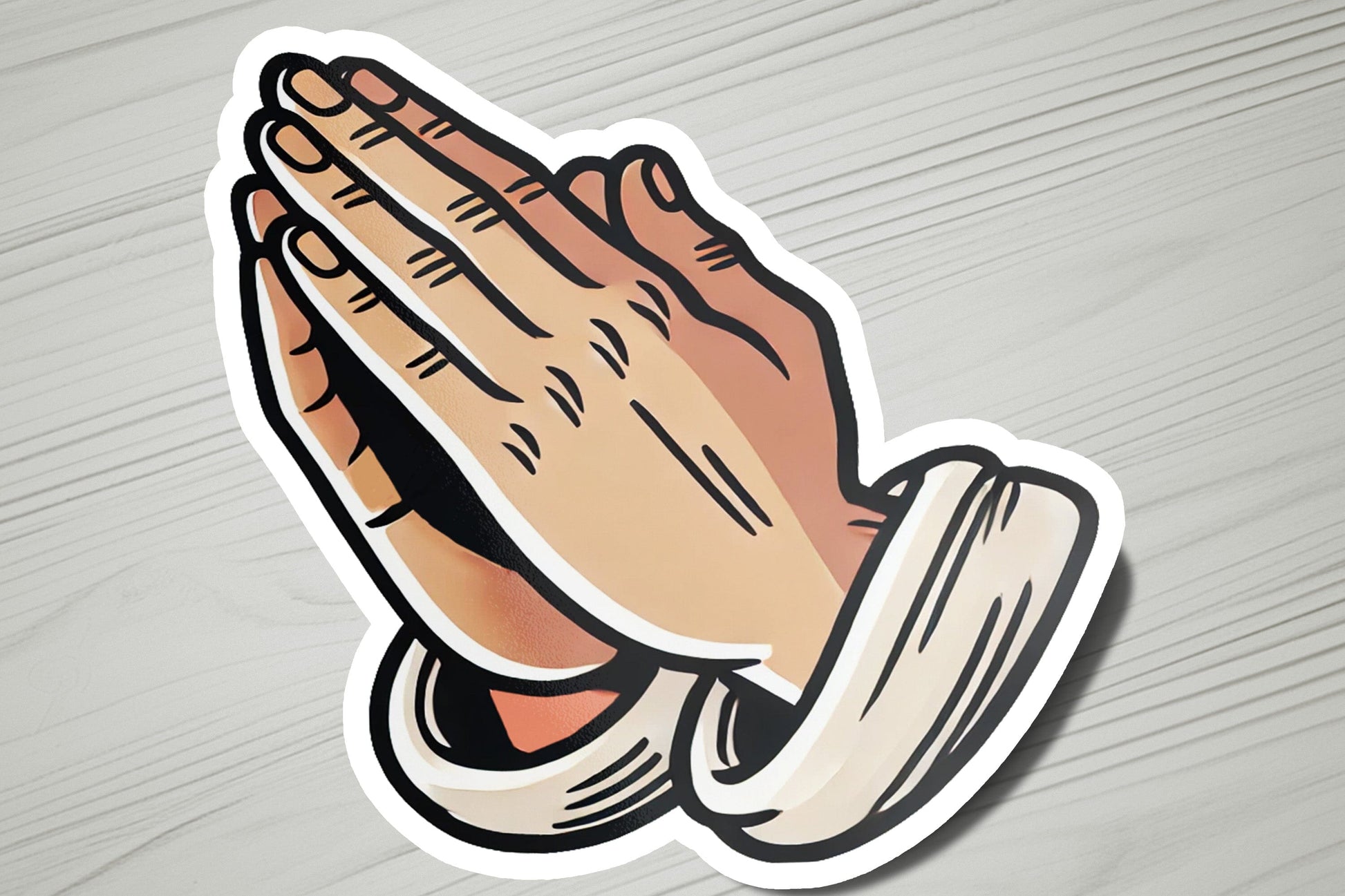 a sticker of a praying hand