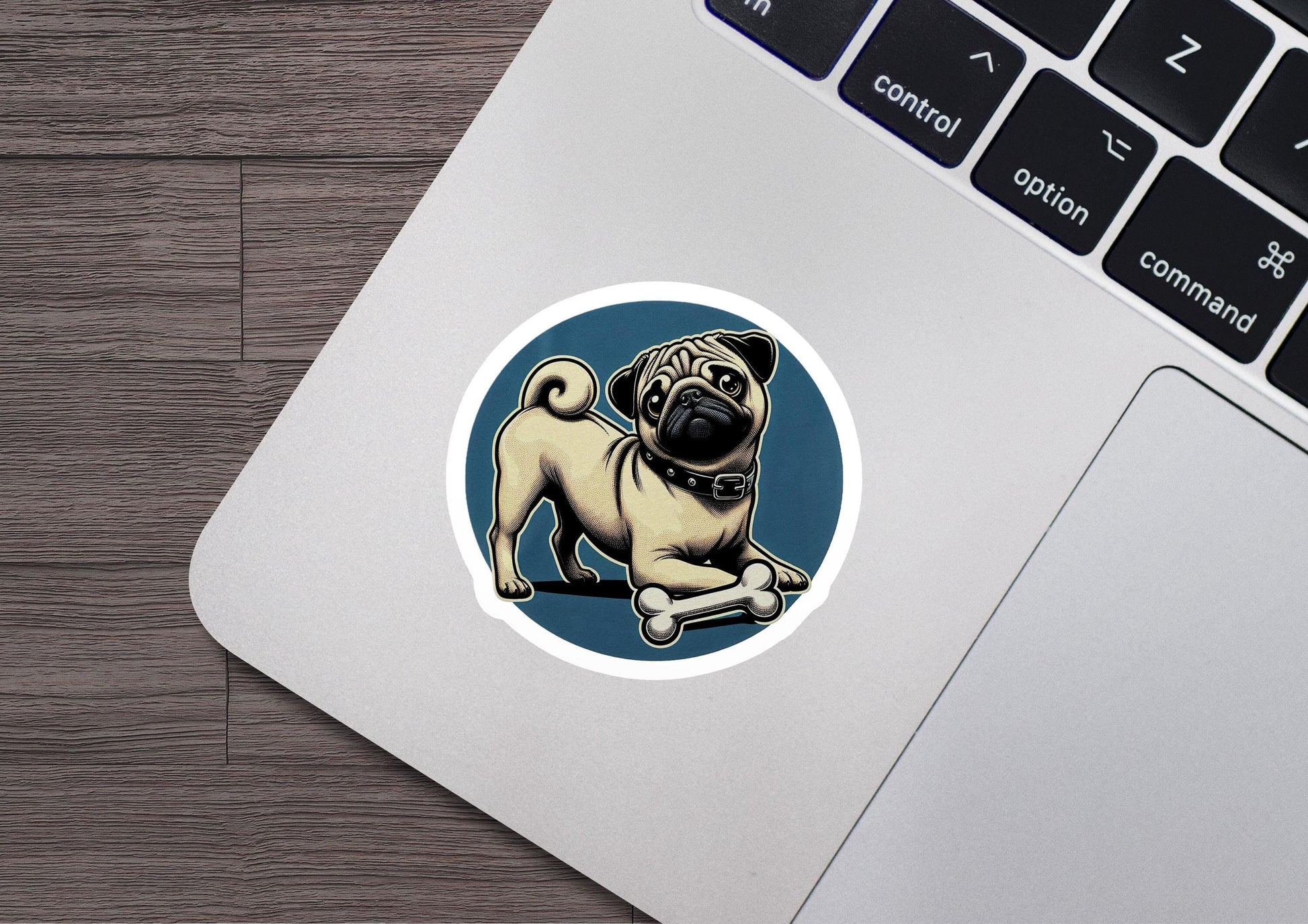 a sticker of a pug dog on a laptop