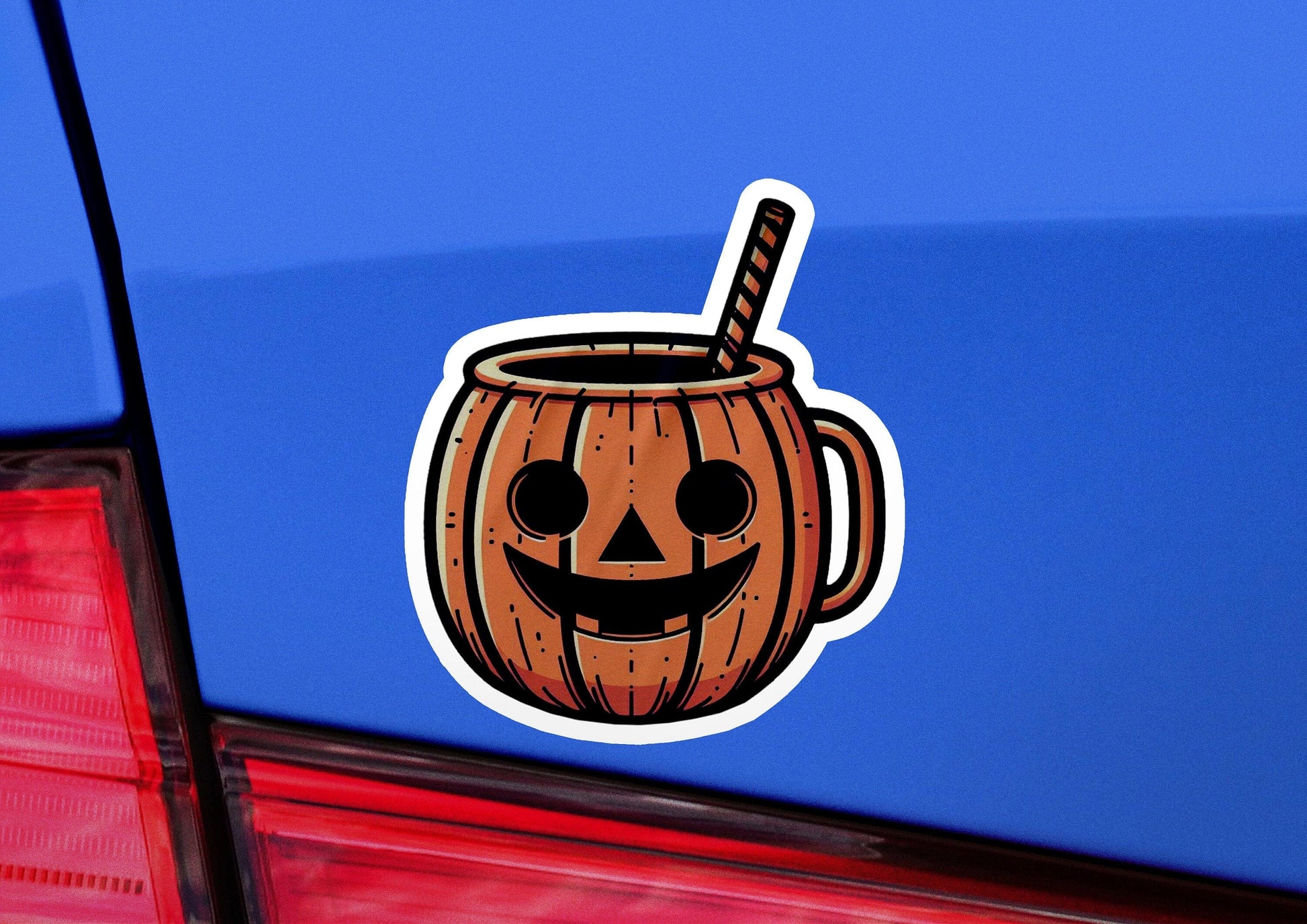 a sticker of a pumpkin mug with a straw sticking out of it