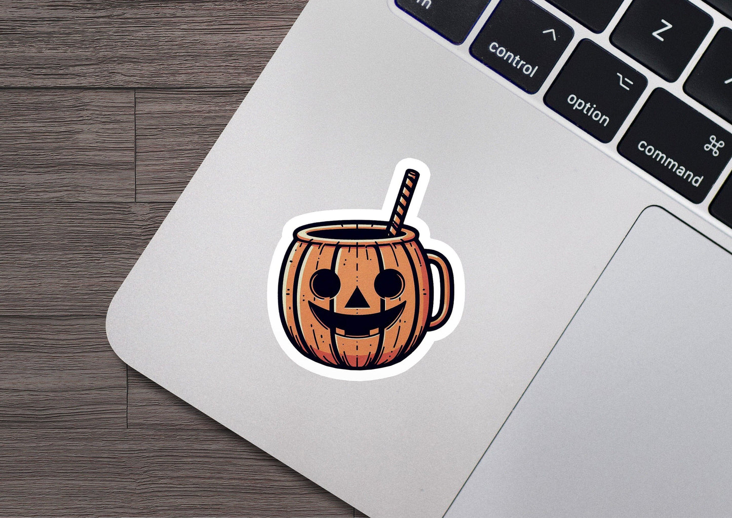 a sticker of a pumpkin mug with a straw sticking out of it