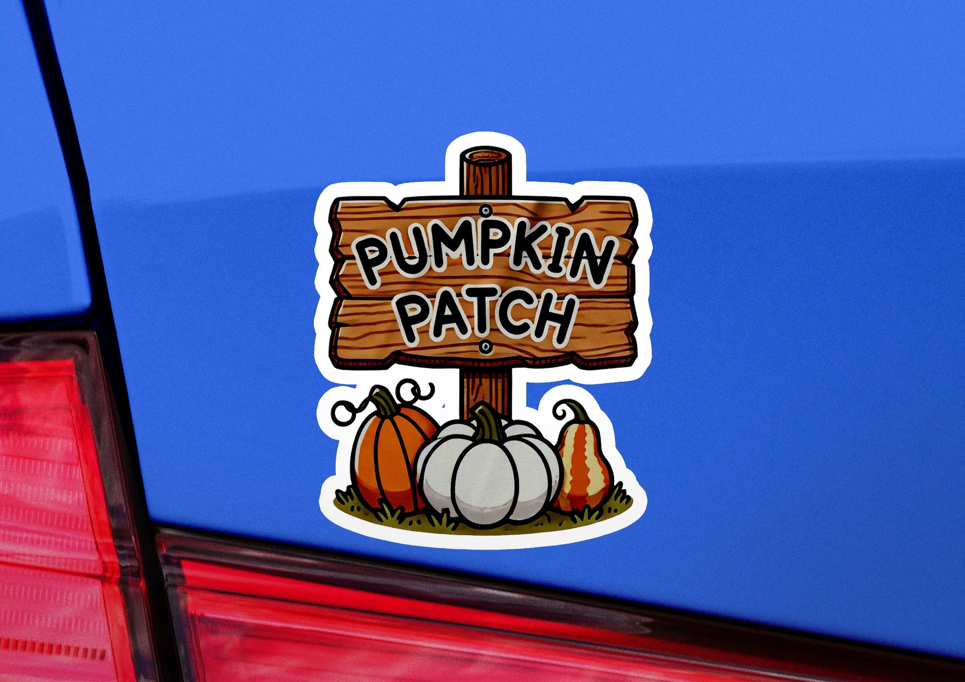 a sticker of a pumpkin patch on the back of a car