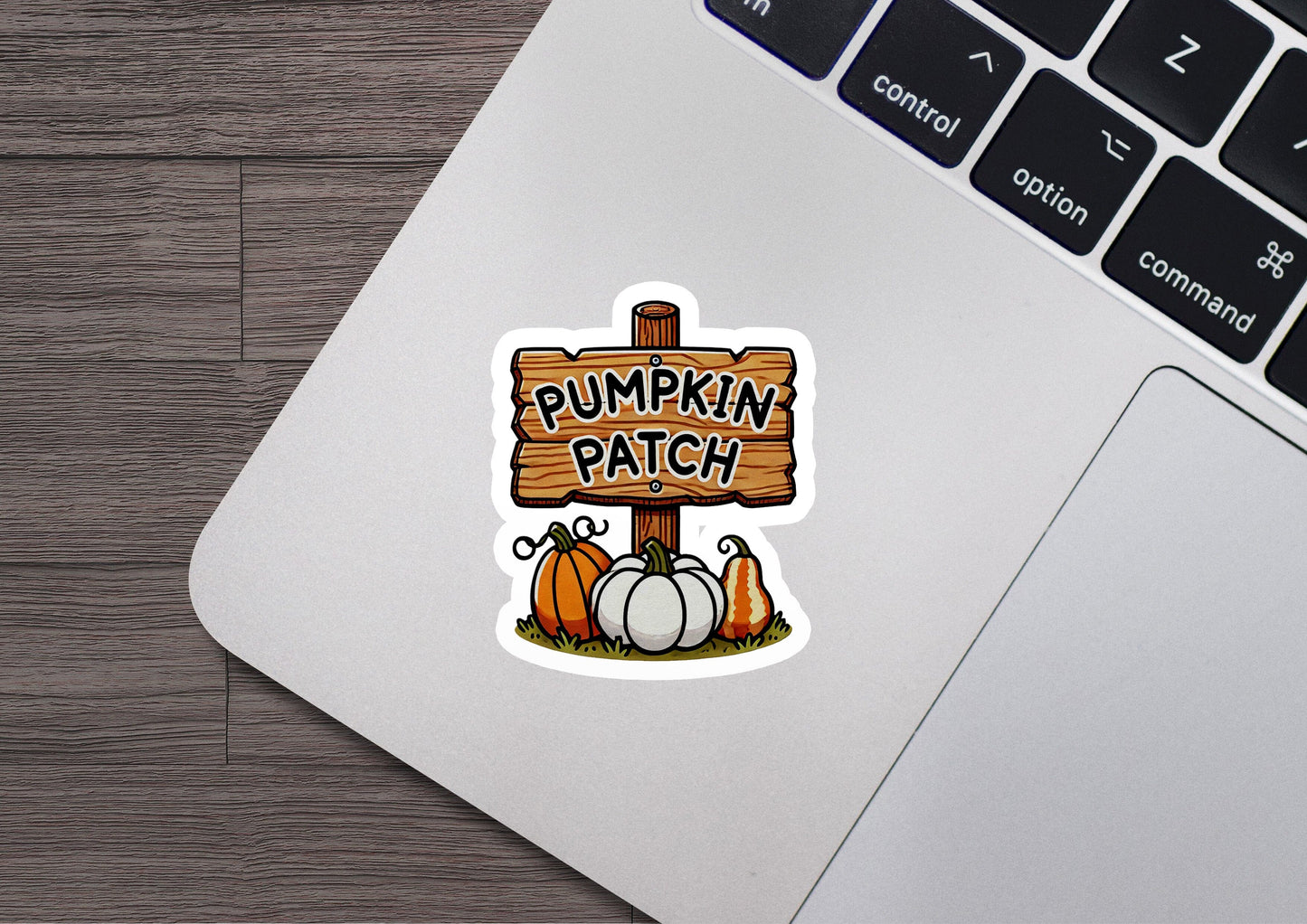 a sticker of a pumpkin patch on a laptop