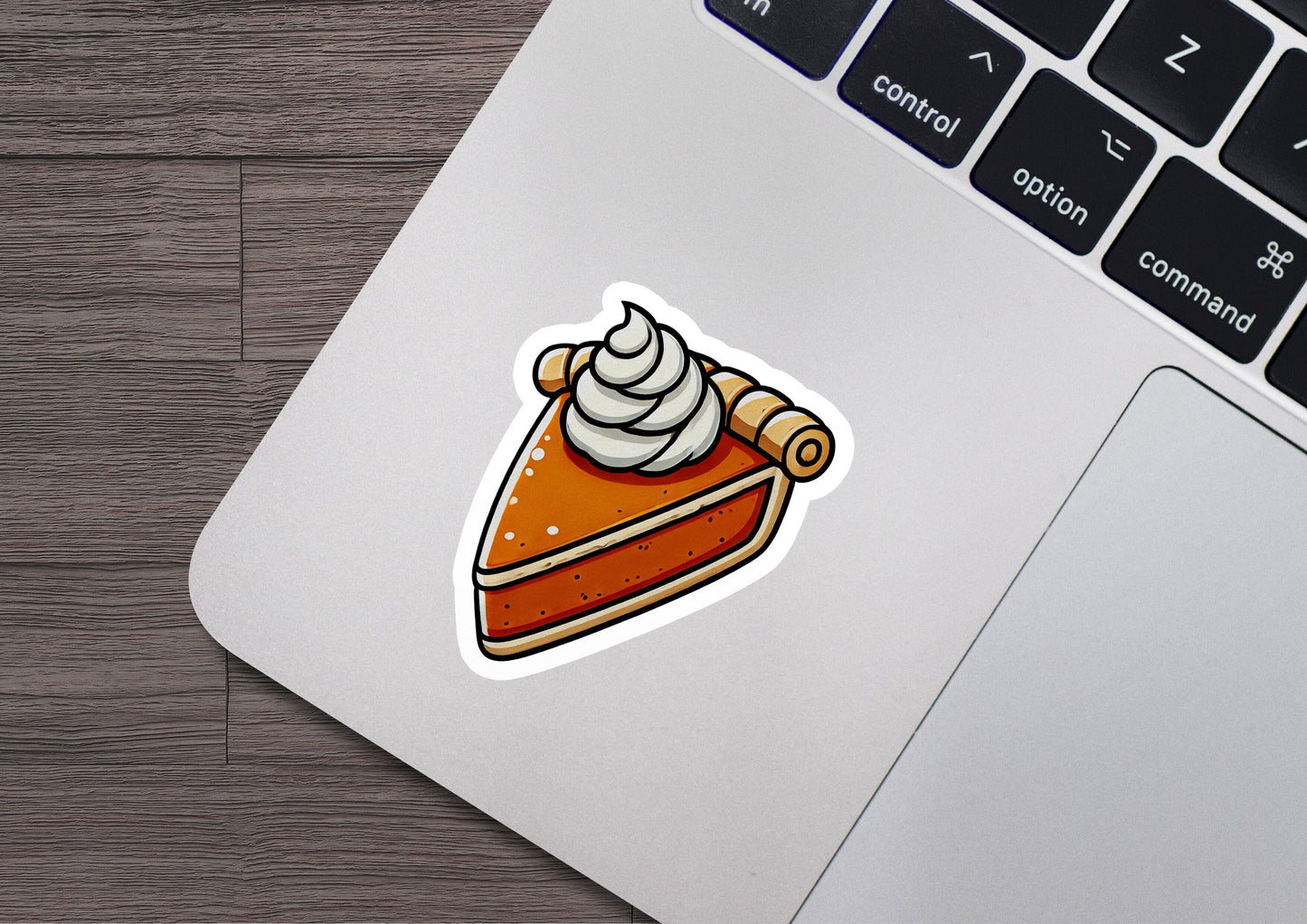 a sticker of a piece of cake on a laptop