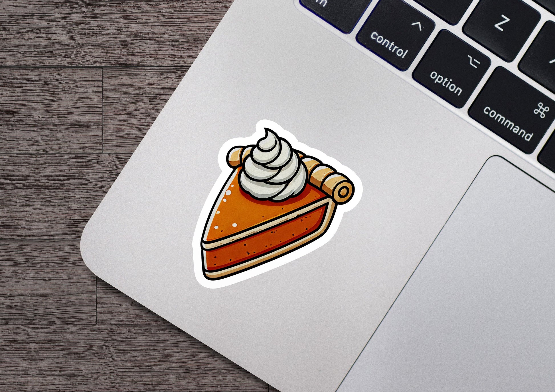 a sticker of a piece of cake on a laptop