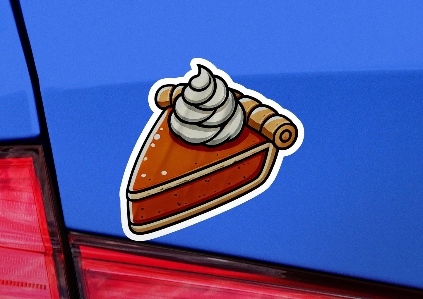 a sticker of a piece of cake on the back of a car