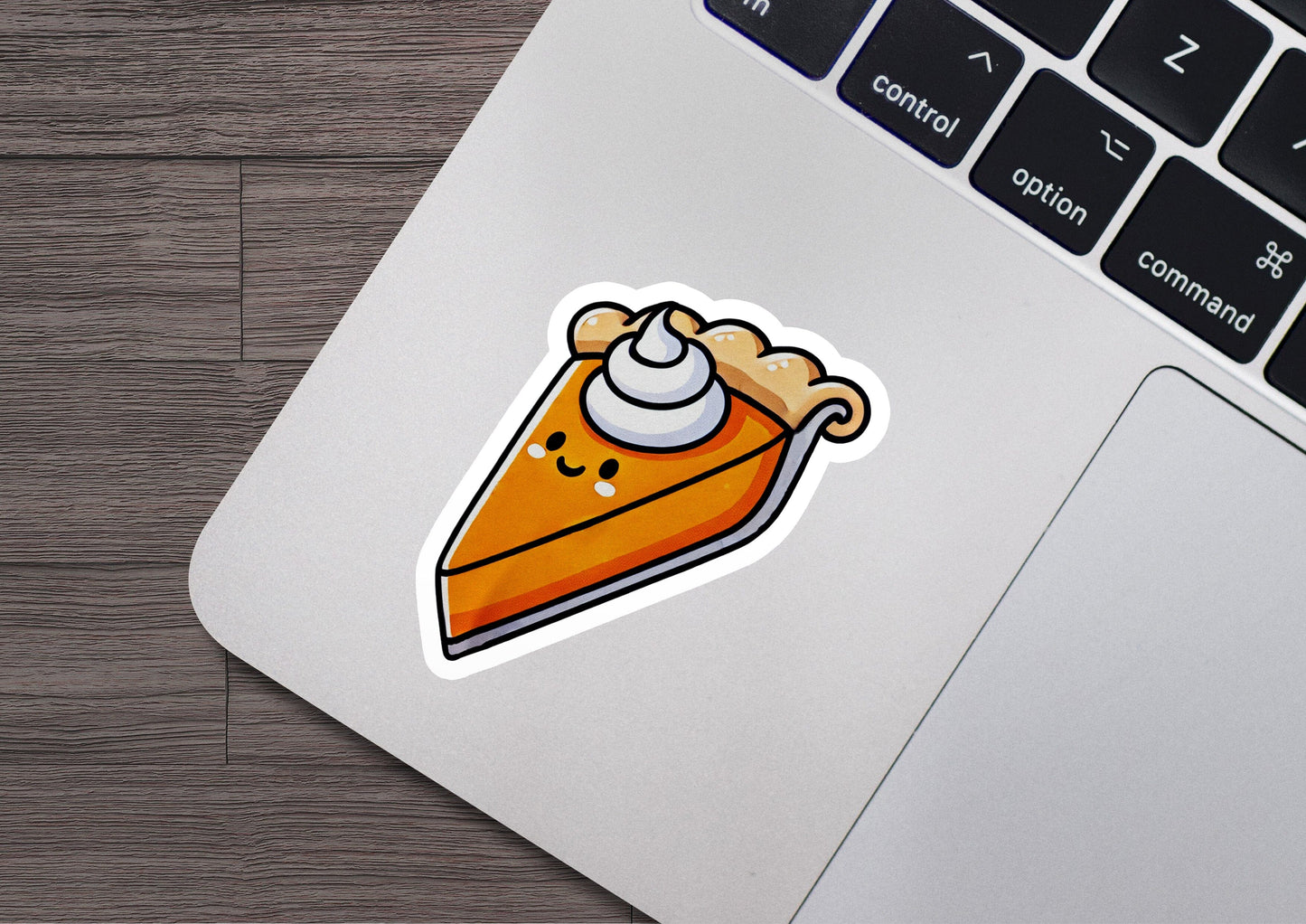 a sticker of a slice of pie on a laptop