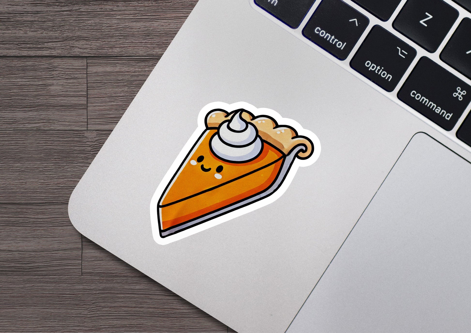 a sticker of a slice of pie on a laptop