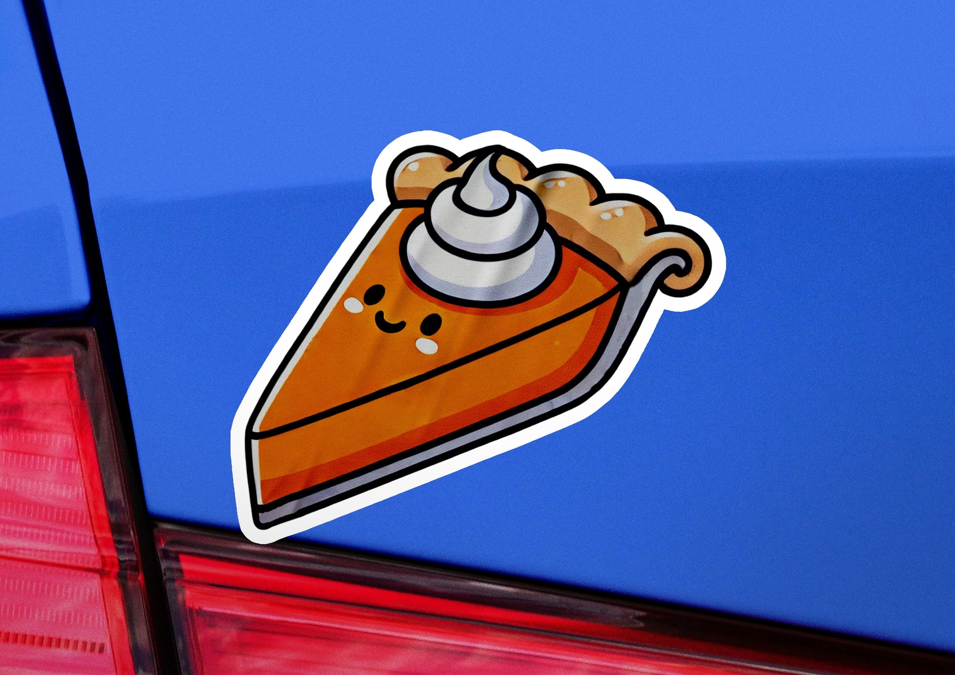 a sticker of a piece of pizza on the back of a car