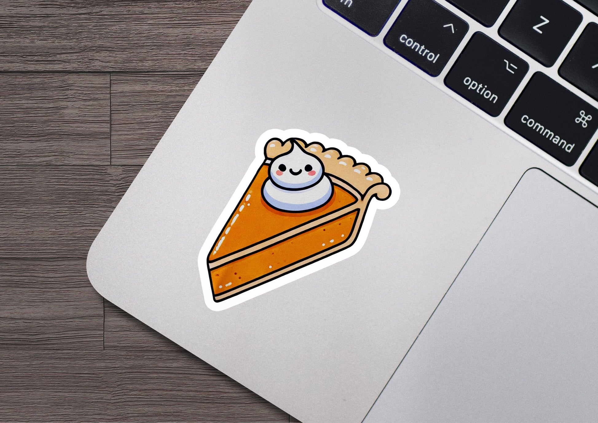a laptop with a sticker of a slice of pie