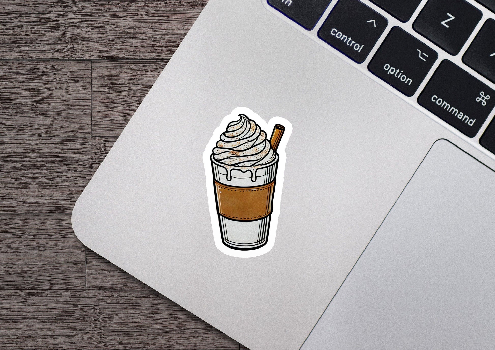 a laptop with a sticker of a cup of coffee