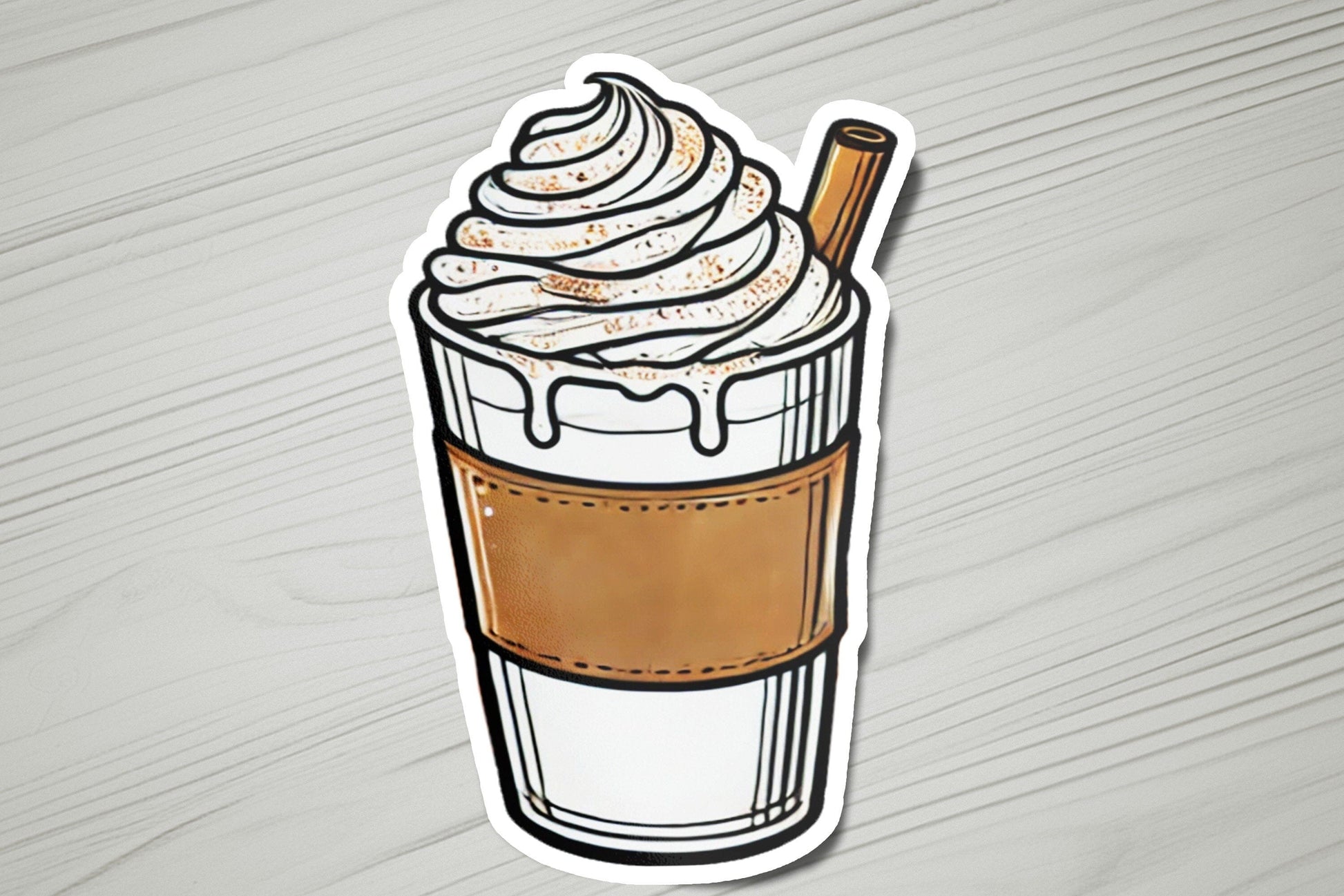 a sticker of a cup of coffee with whipped cream