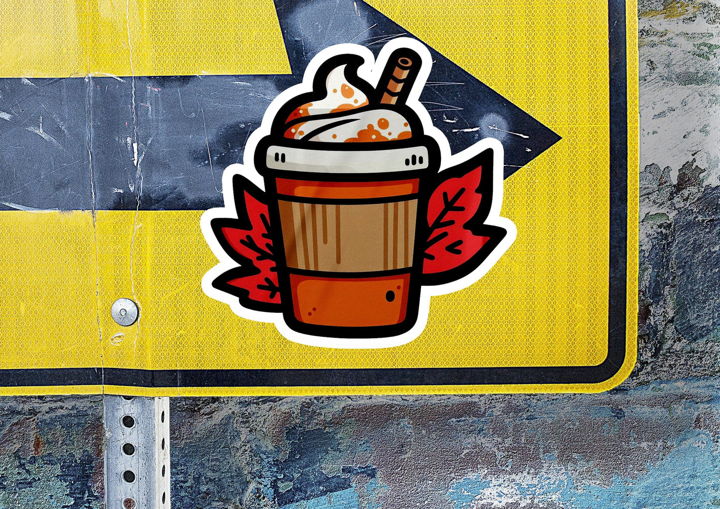 a sticker of a cup of coffee on a street sign