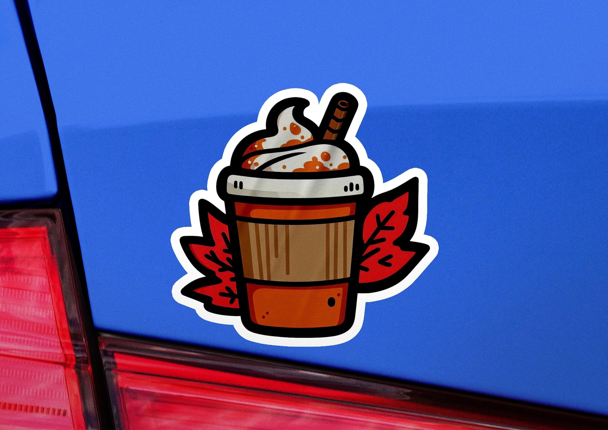 a sticker of a cup of coffee on the back of a car