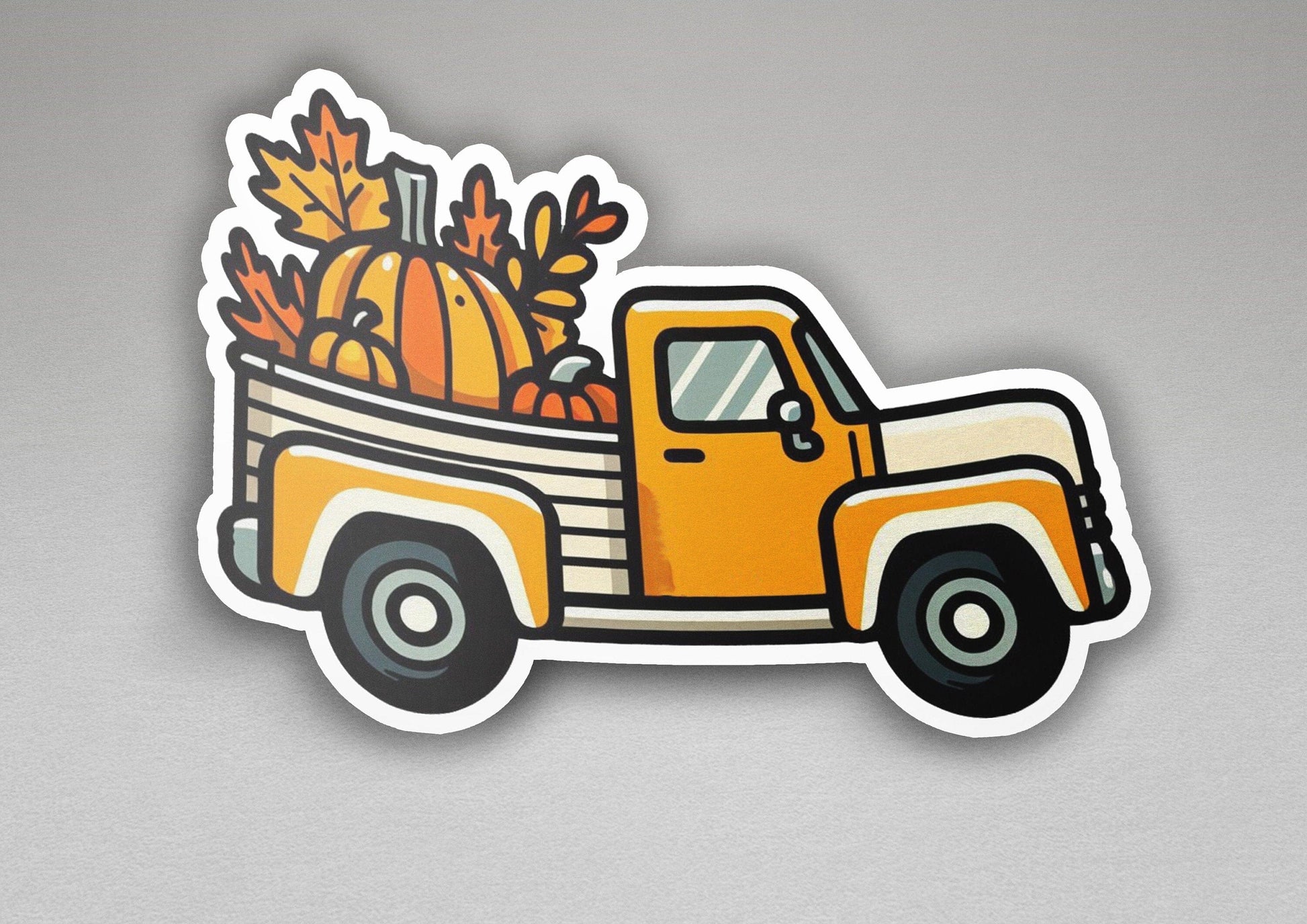 a sticker of a truck with pumpkins in the back