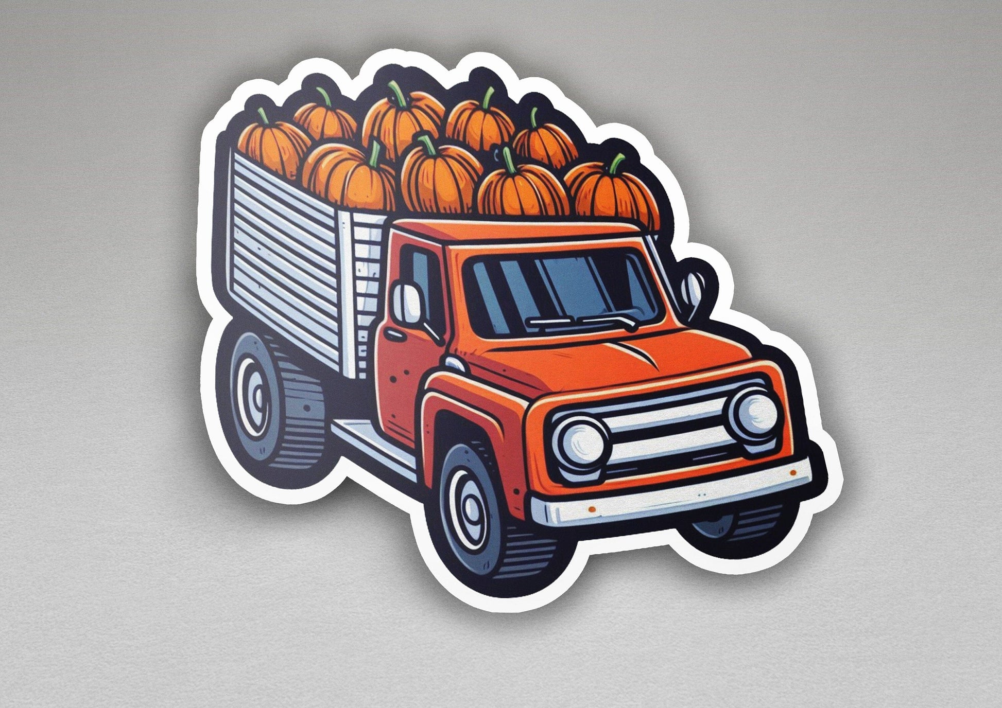 a sticker of a truck filled with pumpkins