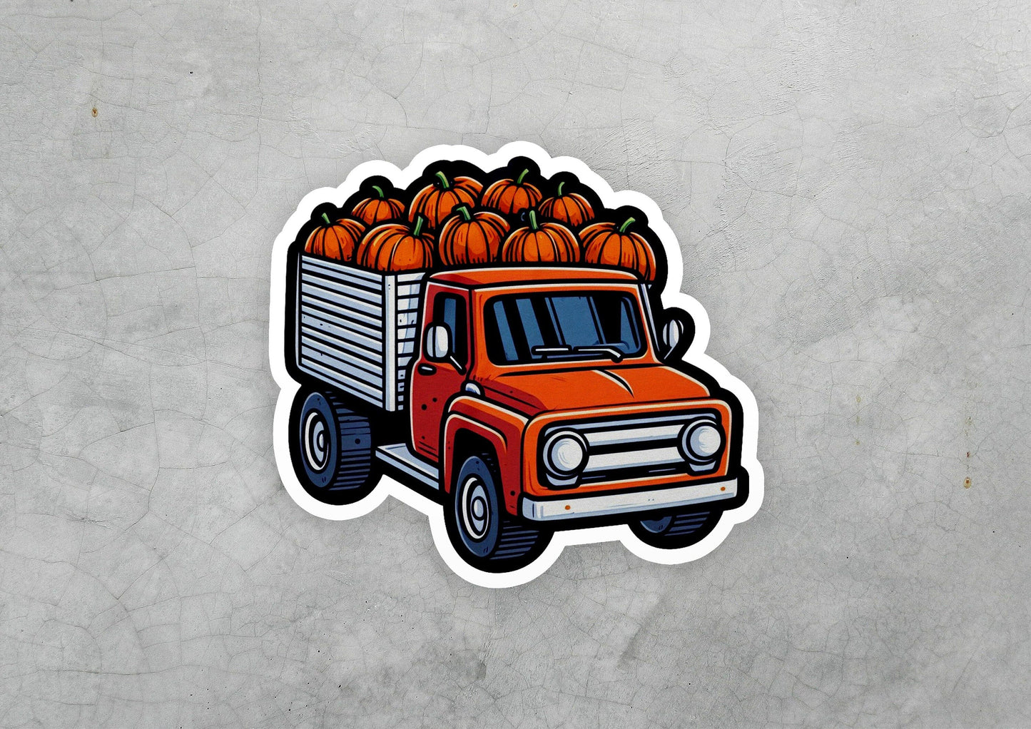 a sticker of a truck with pumpkins on it