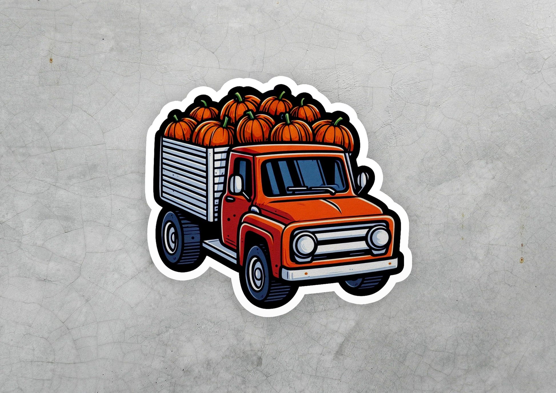 a sticker of a truck with pumpkins on it