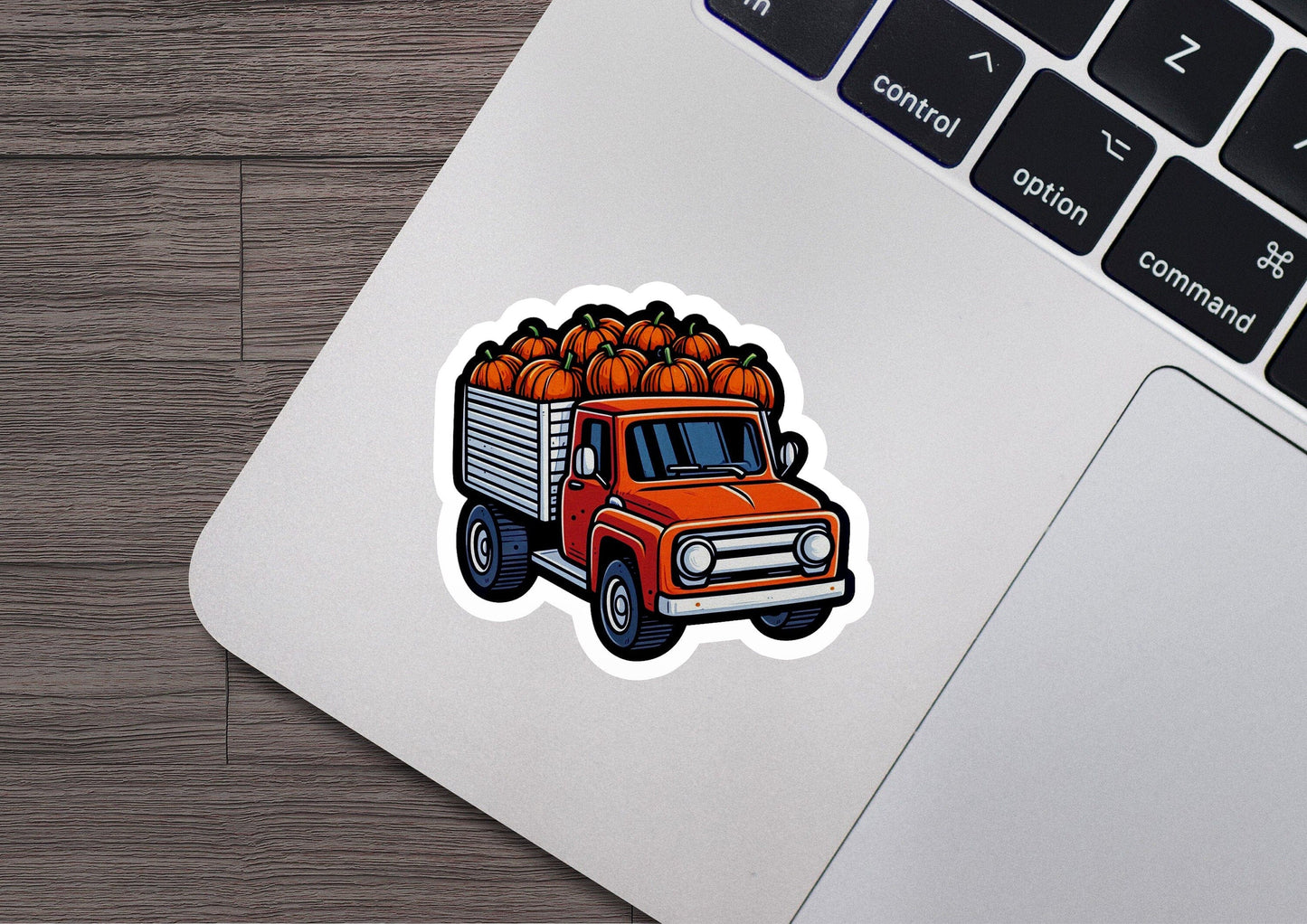a sticker of a truck with pumpkins on it