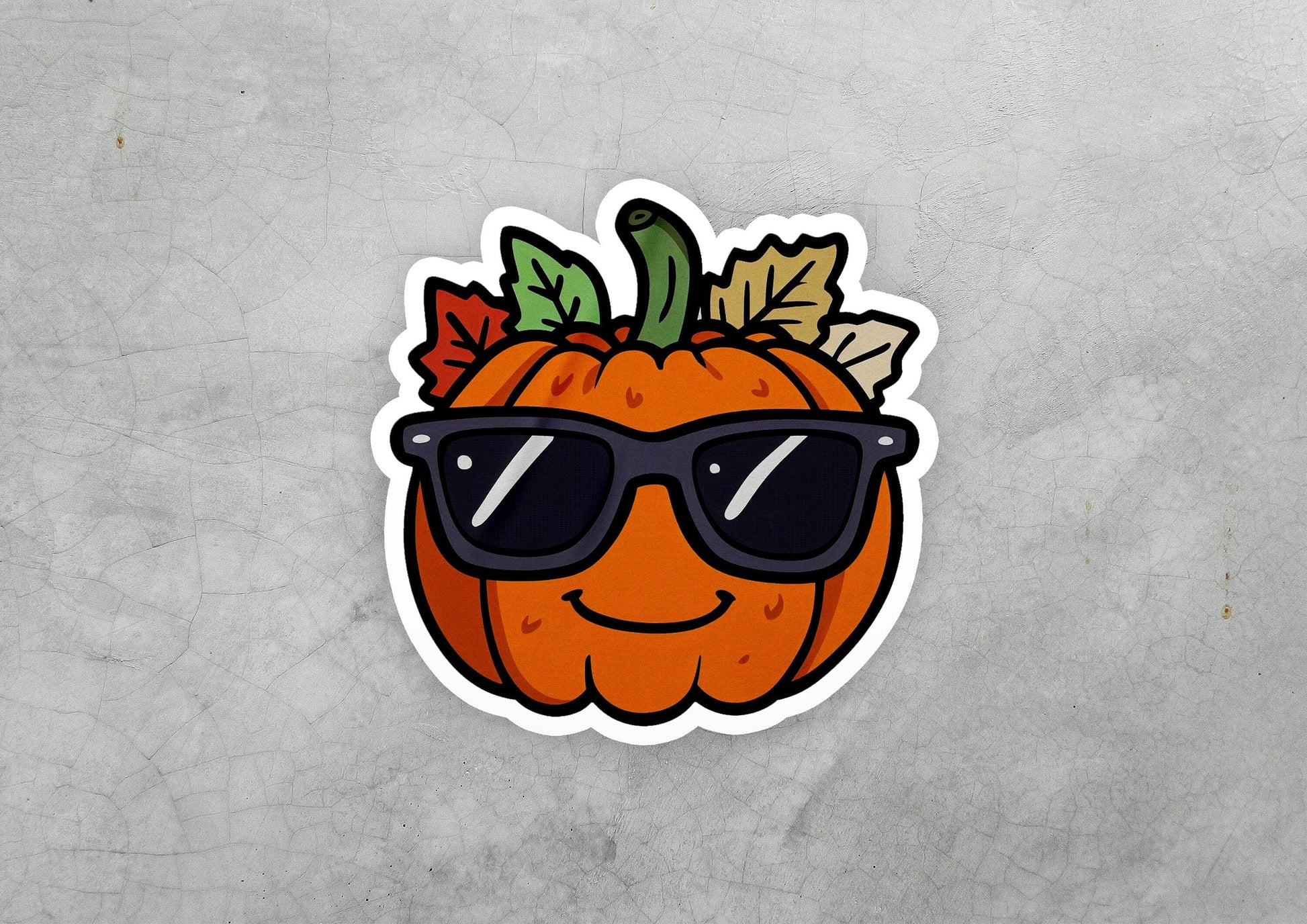 a sticker of a pumpkin wearing sunglasses