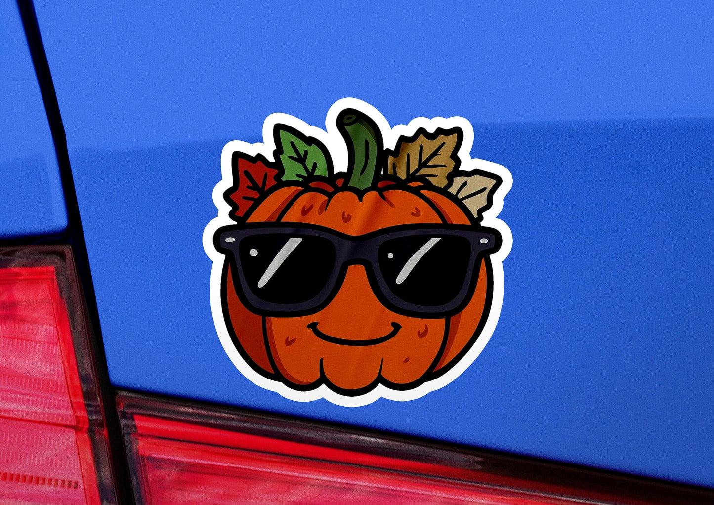 a sticker of a pumpkin wearing sunglasses