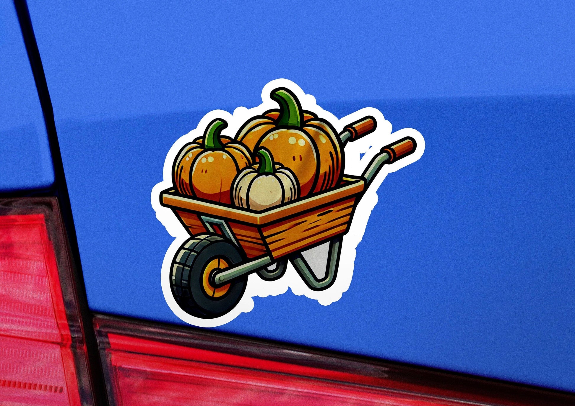 a car with a wheelbarrow filled with pumpkins