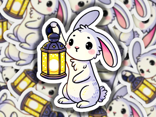 a sticker of a rabbit holding a lantern