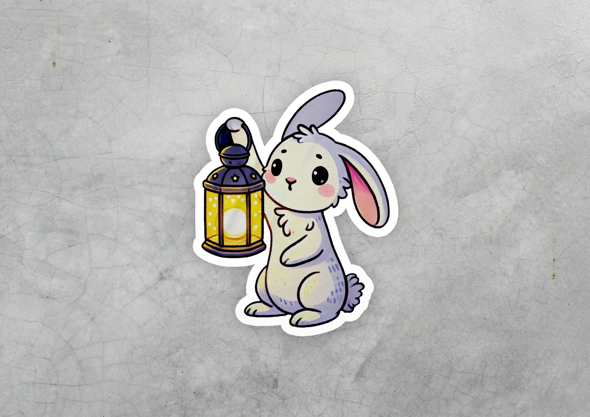 a sticker of a rabbit holding a lantern