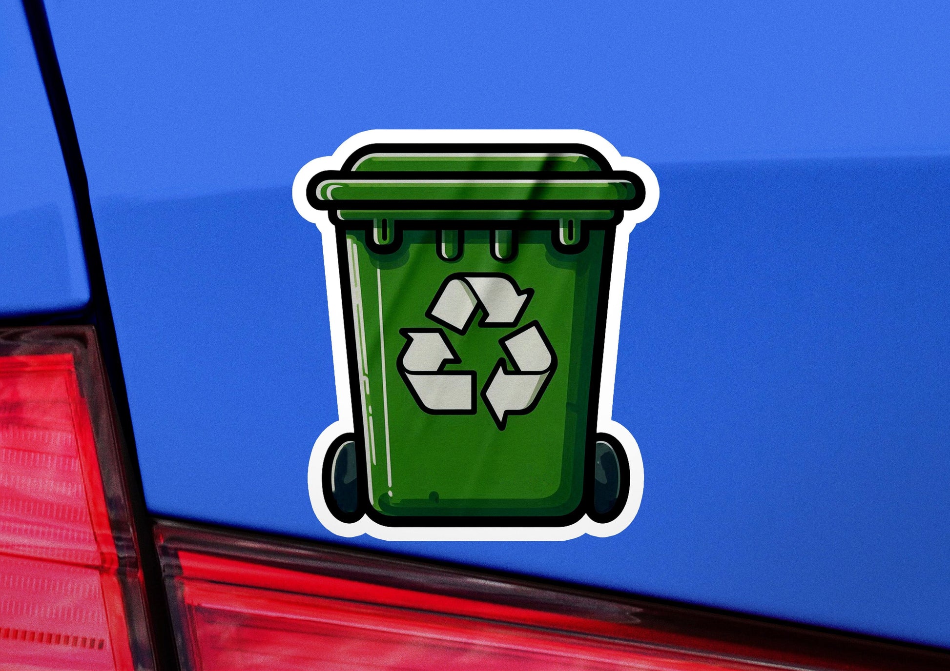 a green recycle sticker on the back of a car