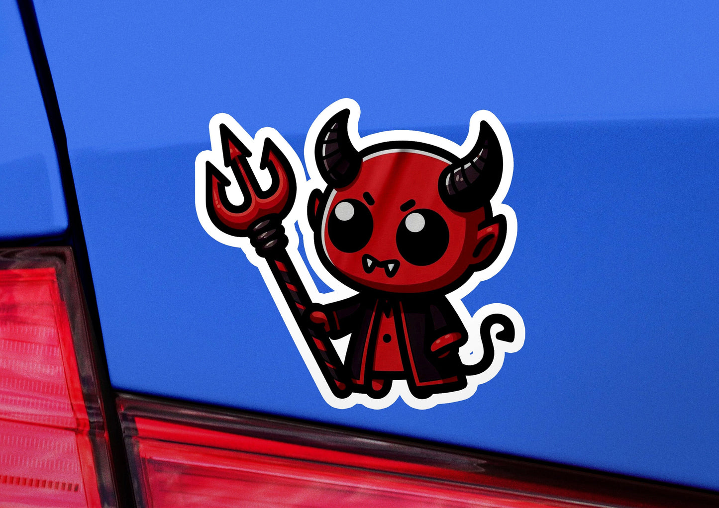 a sticker of a devil holding a wrench
