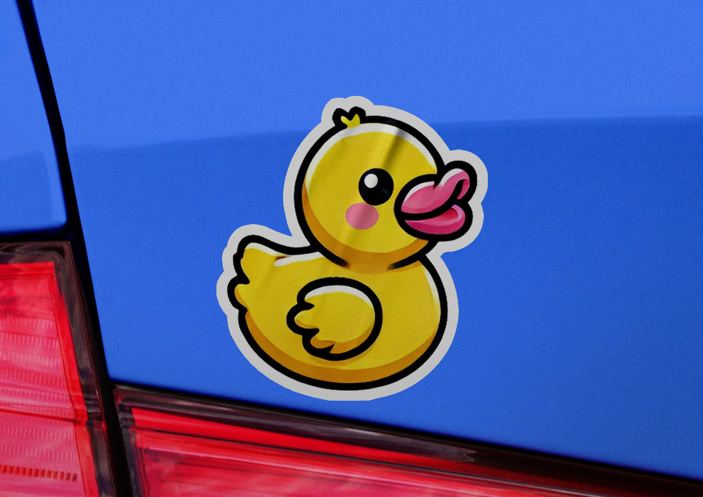a yellow rubber ducky sticker on the back of a blue car