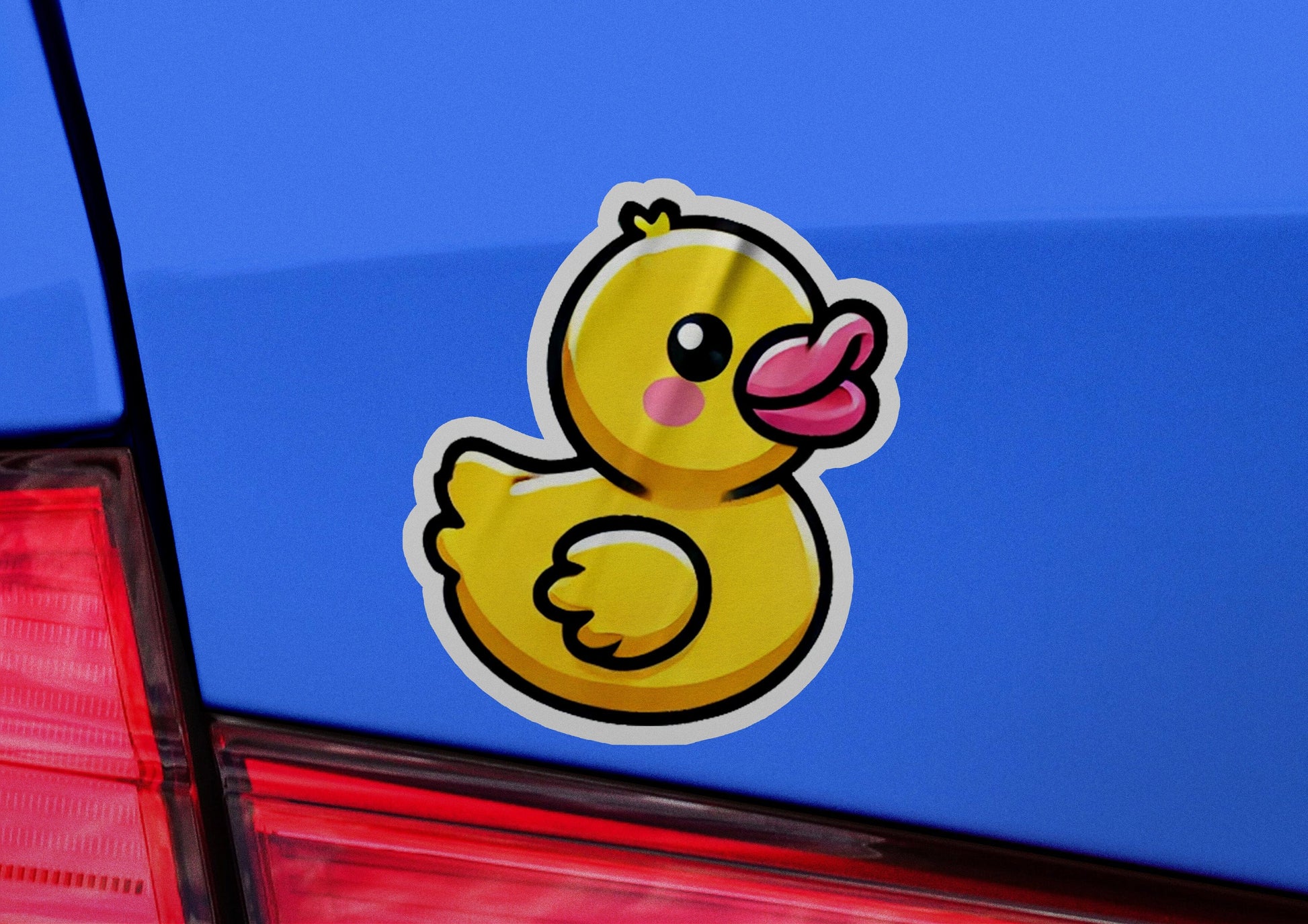 a yellow rubber ducky sticker on the back of a blue car
