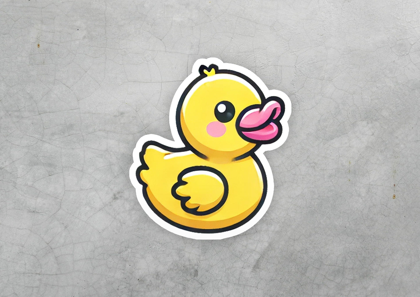 a sticker of a yellow rubber duck