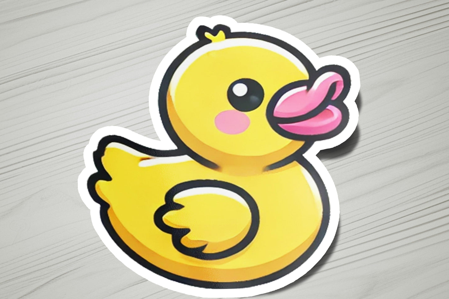 a sticker of a yellow rubber duck
