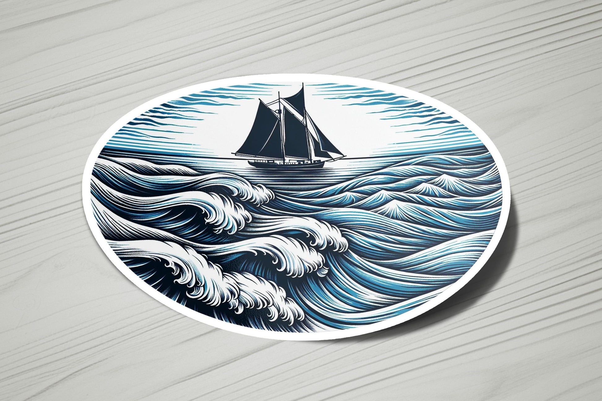 a blue and white plate with a sailboat on it