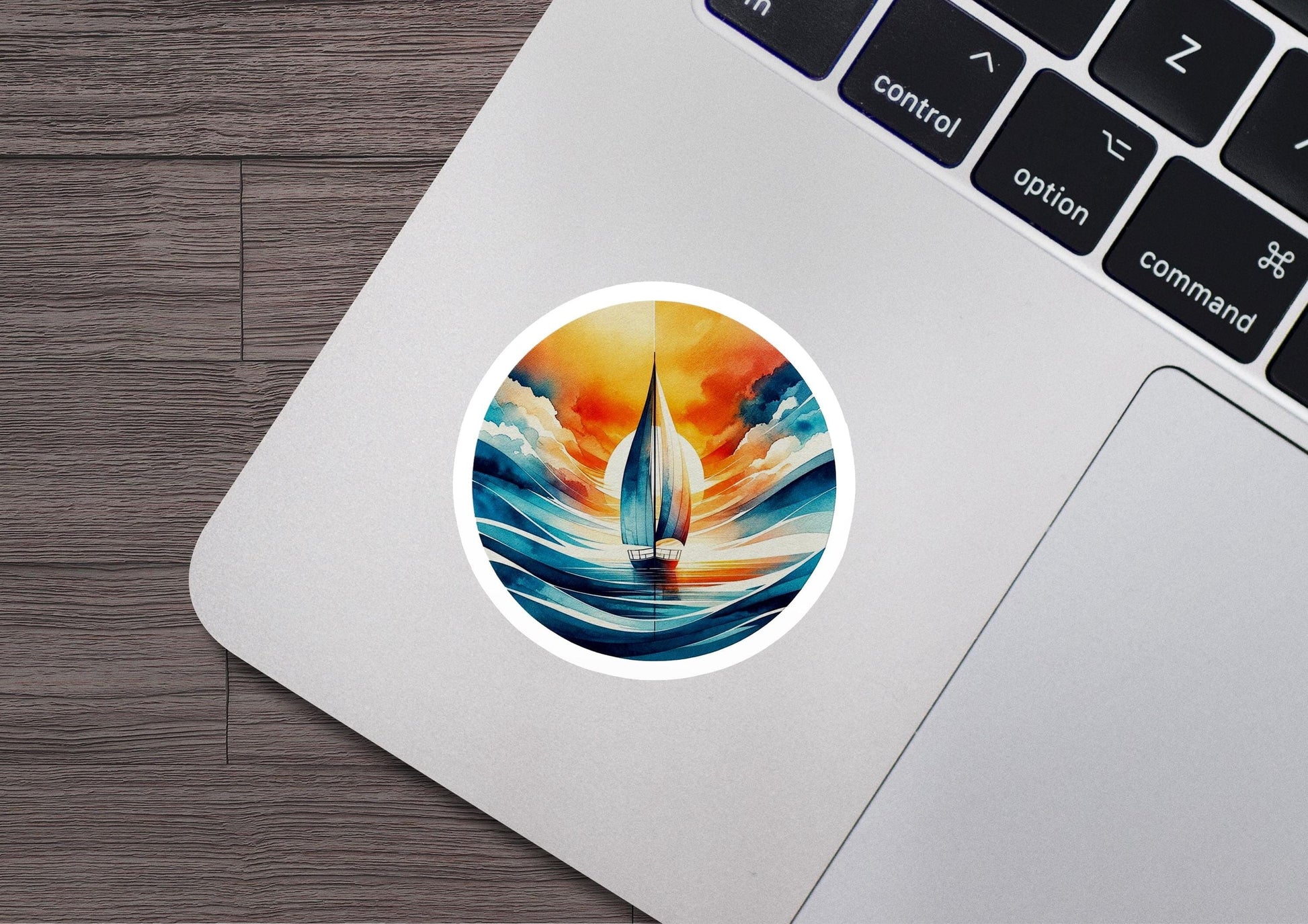 a laptop with a sticker of a sailboat on it