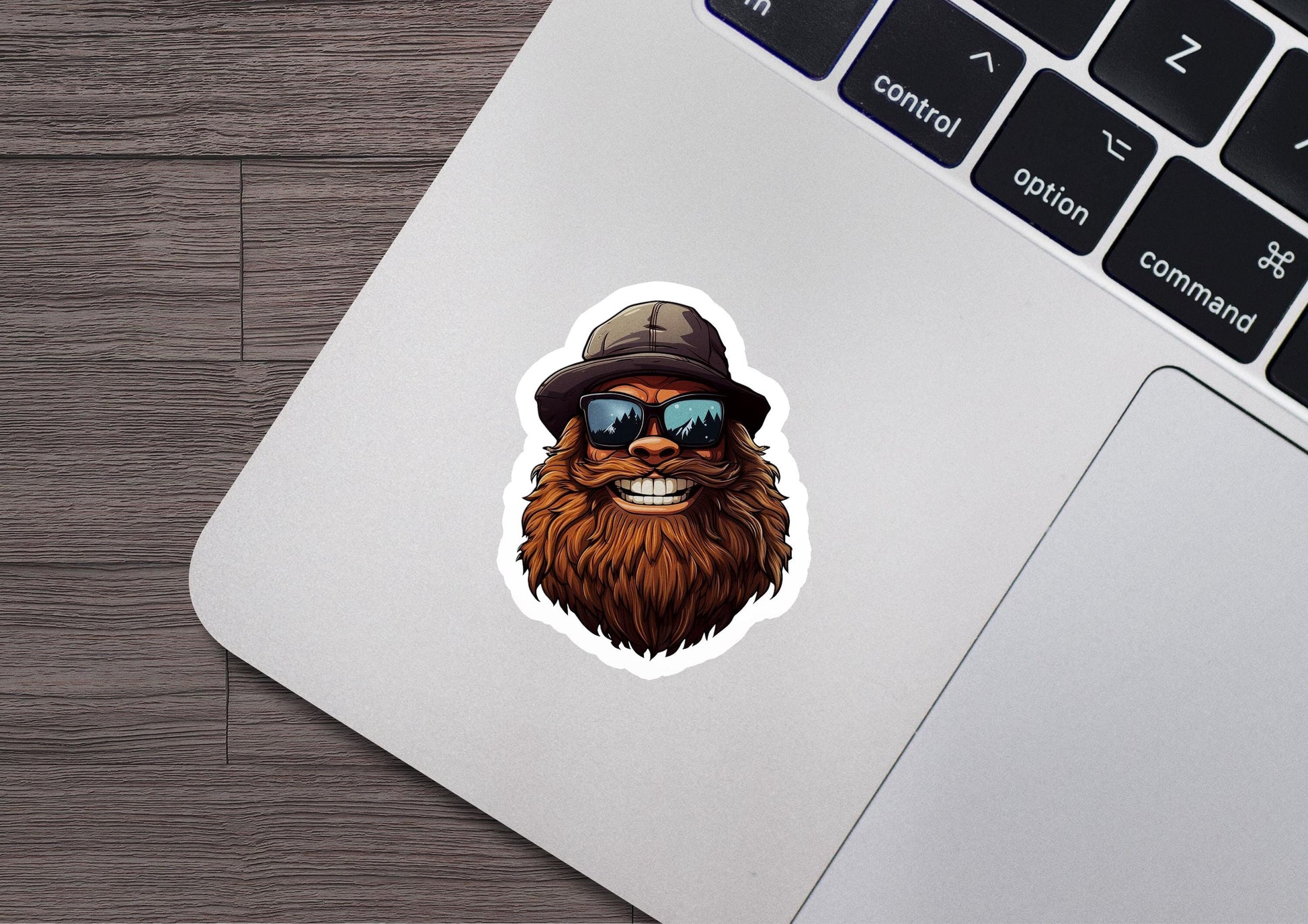 a laptop with a sticker of a bear wearing a hat and sunglasses