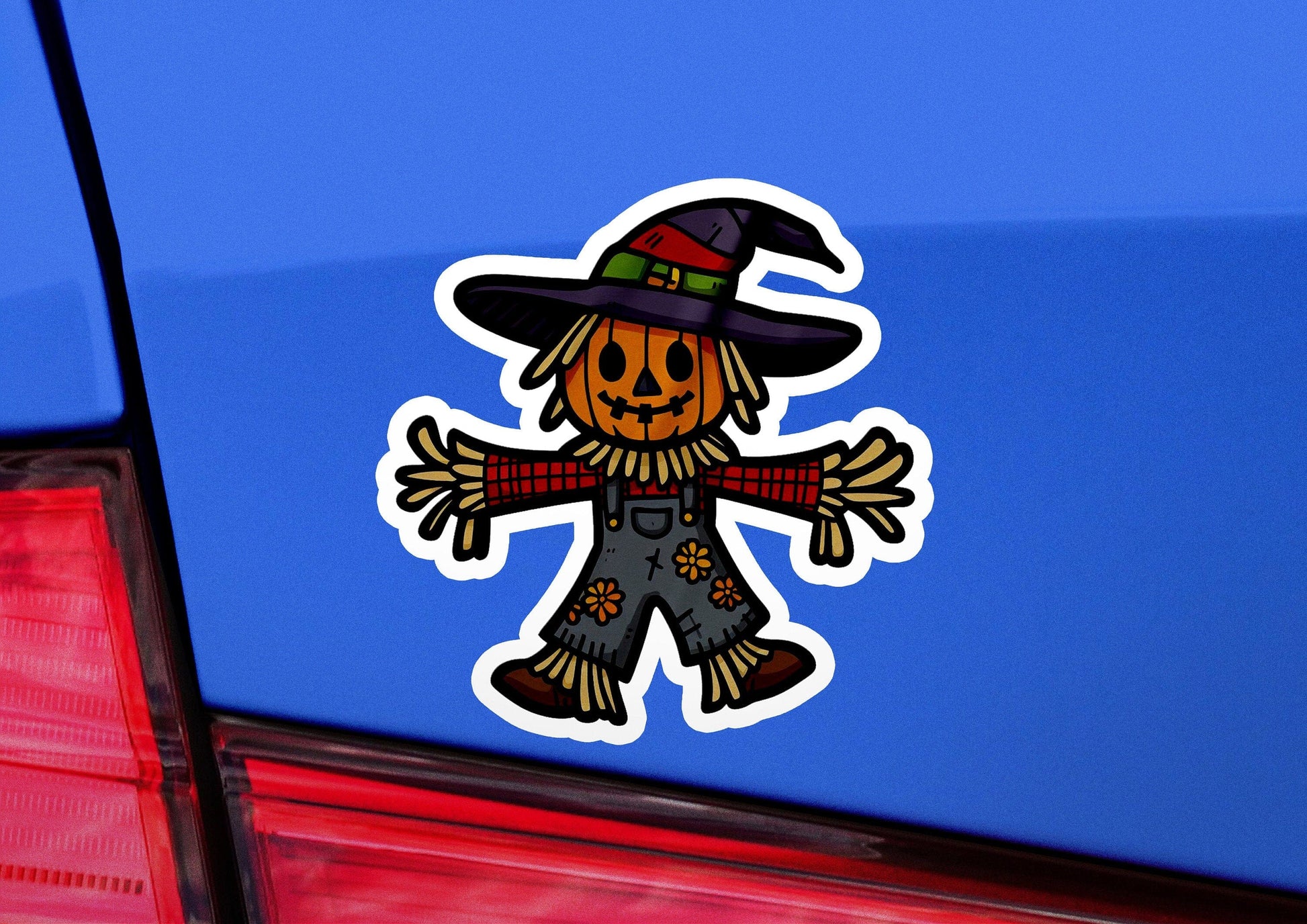 a car with a sticker of a scarecrow on it
