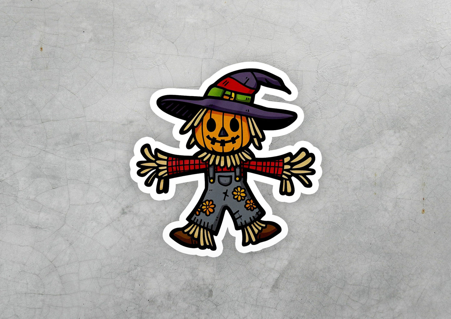 a sticker of a scarecrow wearing a witches hat