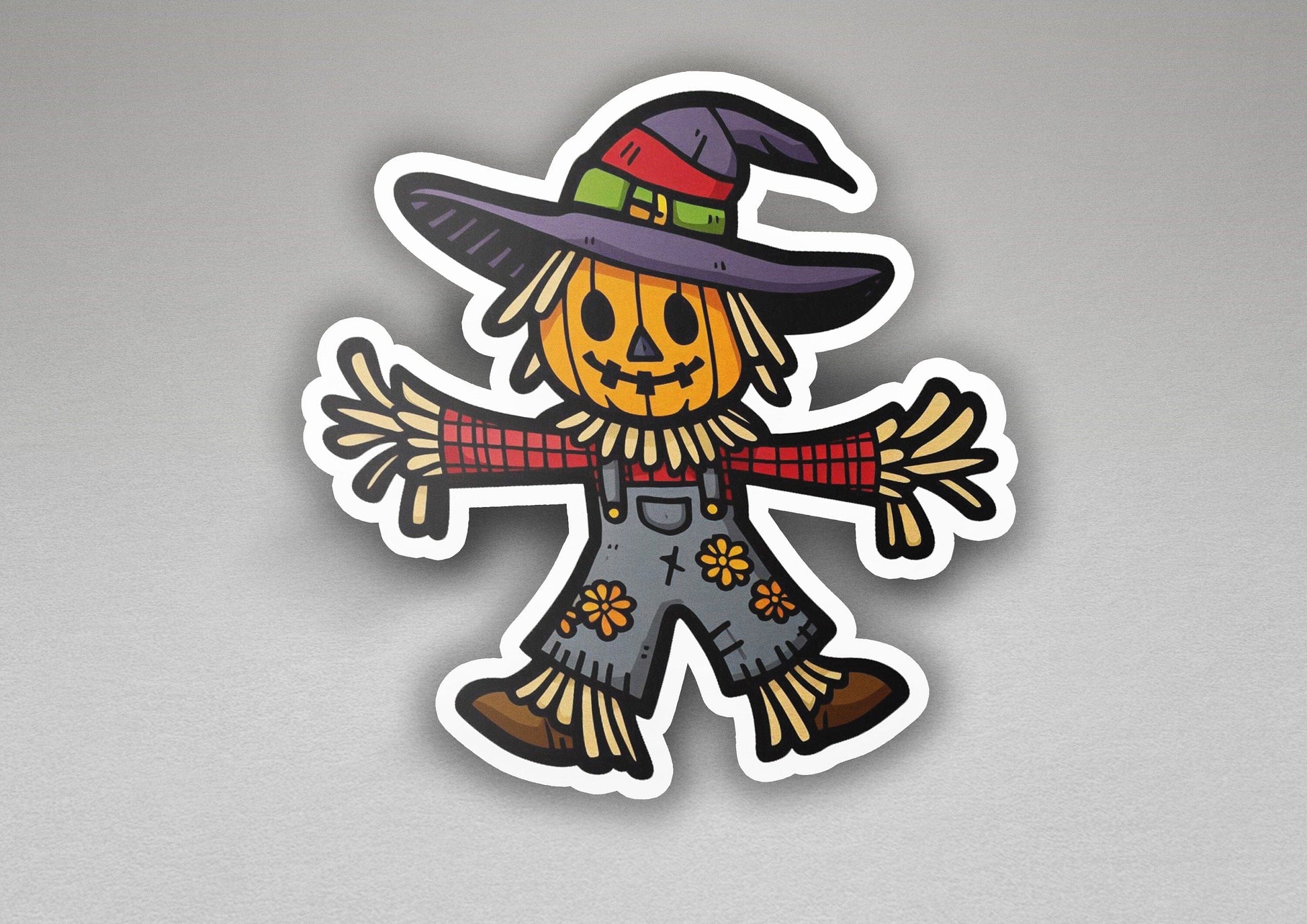 a sticker of a scarecrow wearing a witches hat