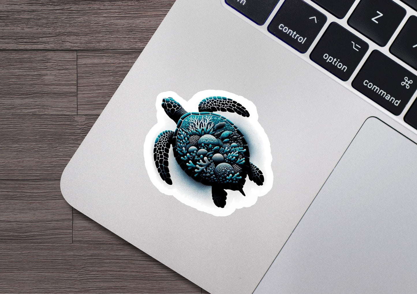 a sticker of a sea turtle on a laptop