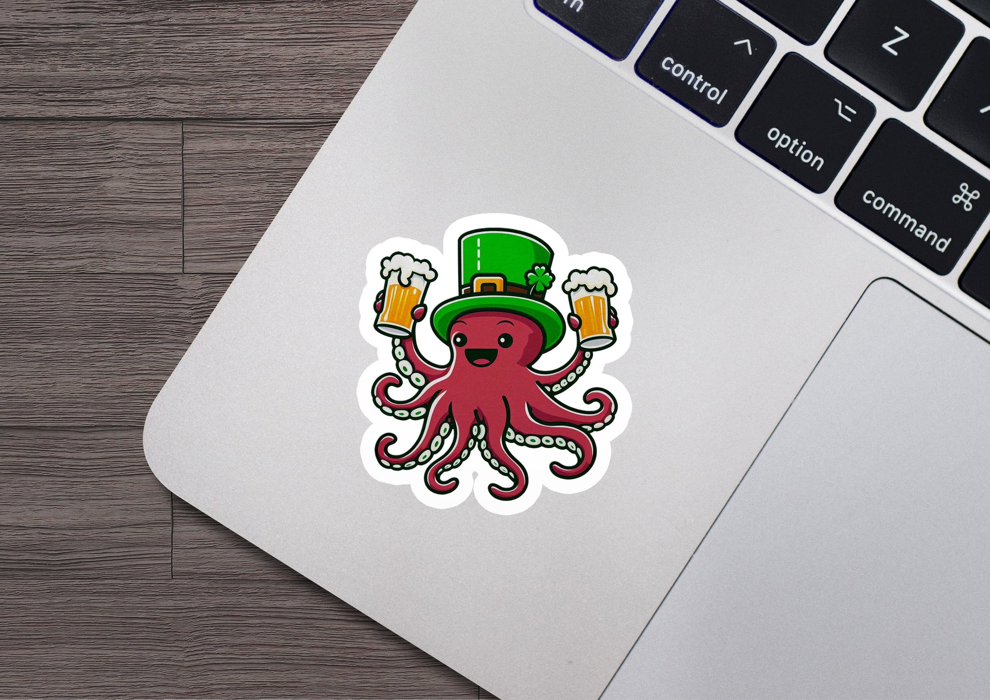 a laptop with a sticker of an octopus wearing a hat