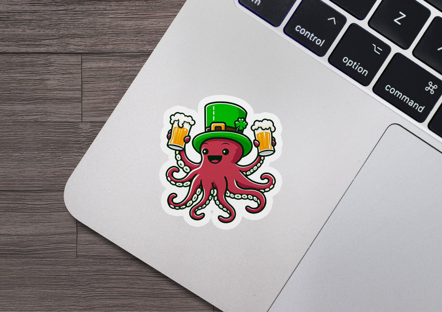 a laptop with a sticker of an octopus wearing a hat