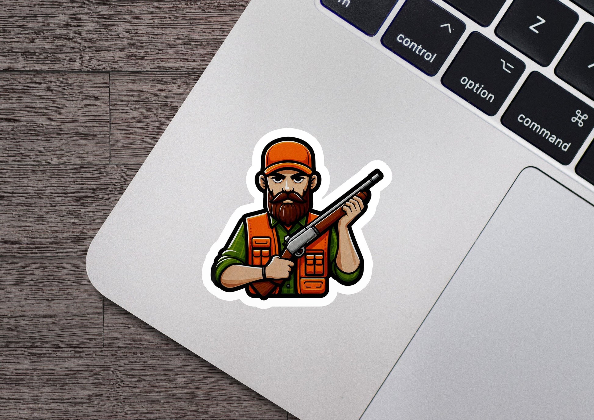 a sticker of a man with a gun on a laptop