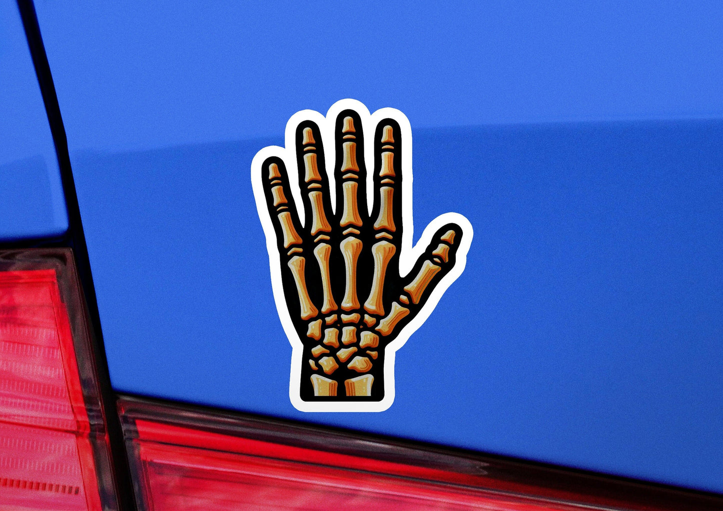 a sticker of a hand on the back of a car